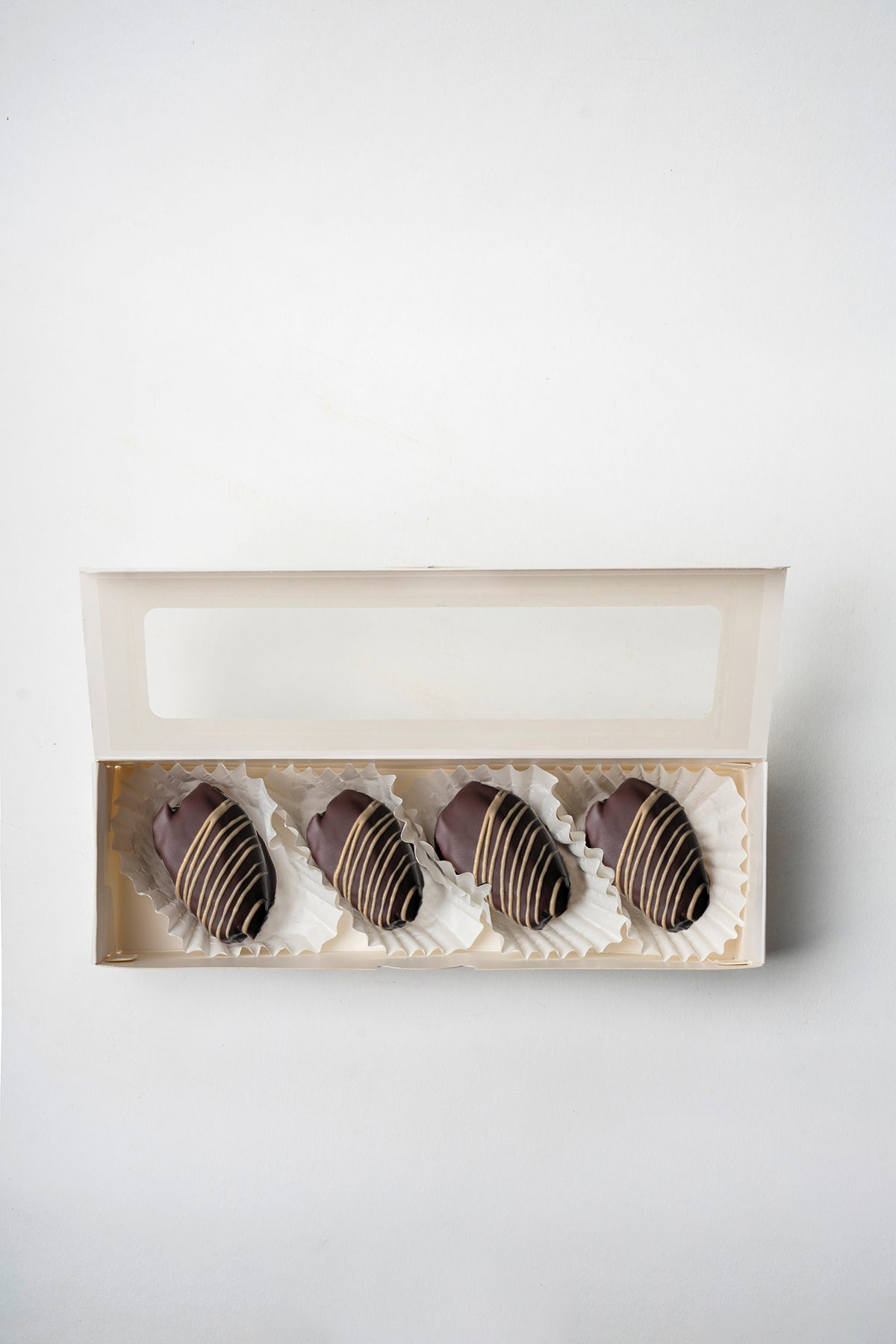 Dátil con coco y cubierto en chocolate